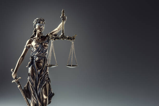 Statute of Justice. Bronze statue Lady Justice holding scales and sword Statute of Justice. Bronze statue Lady Justice holding scales and sword. blind justice stock pictures, royalty-free photos & images